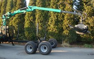 Forestry trailer for tractors with hydraulic arm