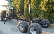 Forestry trailer for tractors with hydraulic arm